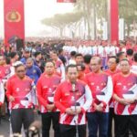 Kapolri Jenderal Listyo Sigit Prabowo, saat menghadiri acara Fun Walk Out hari Bhayangkara ke-77 bertempat di Monumen Nasional (Monas) Jakarta. Foto: Polri
