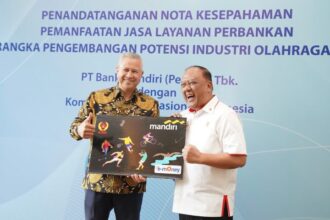 enandatanganan nota kesepahaman layanan perbankan terintegrasi antara kedua pihak yang dilakukan oleh Direktur Hubungan Kelembagaan Bank Mandiri Rohan Hafas dan Ketua Umum KONI Pusat Marciano Norman di Jakarta, Senin (20/2/2024). Foto: Dok Bank Mandiri